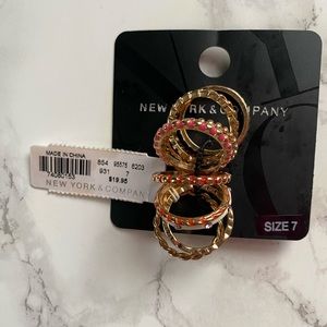 New York & Company 9 rings total . Size 7 Multiple colors .